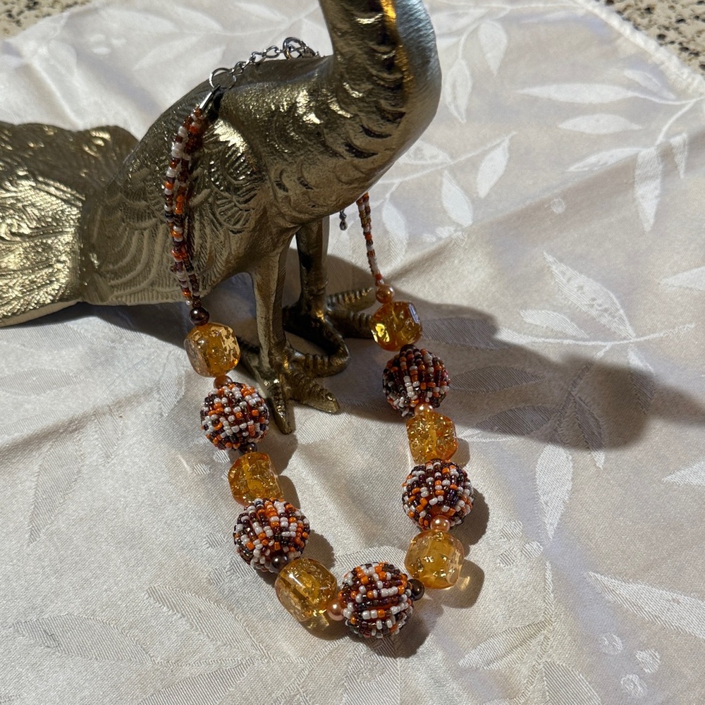 Elegant Beaded Necklace with Amber and Brown Tones
